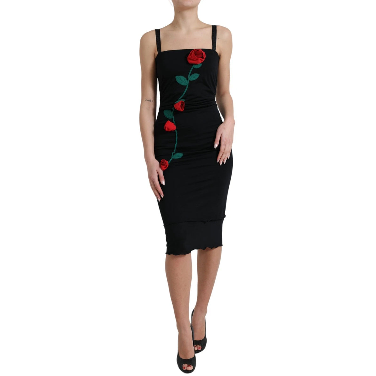 Indulge in the allure of the Dolce & Gabbana Black Wool Sleeveless Rose Applique Dress, a masterpiece of Italian craftsmanship that embodies timeless elegance and sophistication.