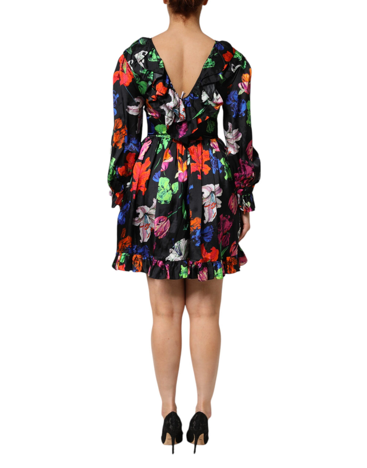 Discover the MSGM Dress Black Multicolor Floral Ruffle Long Sleeve Mini Dress, a masterpiece of Italian craftsmanship that embodies luxury and timeless elegance.