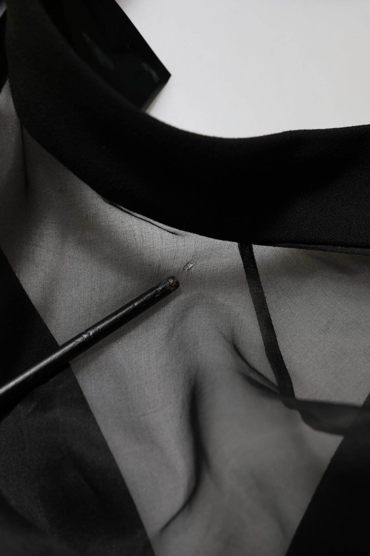 Indulge in the exquisite elegance of the Emporio Armani Black Sheer Sleeve Belted V-Neck Mini Dress, a luxurious blend of craftsmanship and sensuality, perfect for any sophisticated occasion.