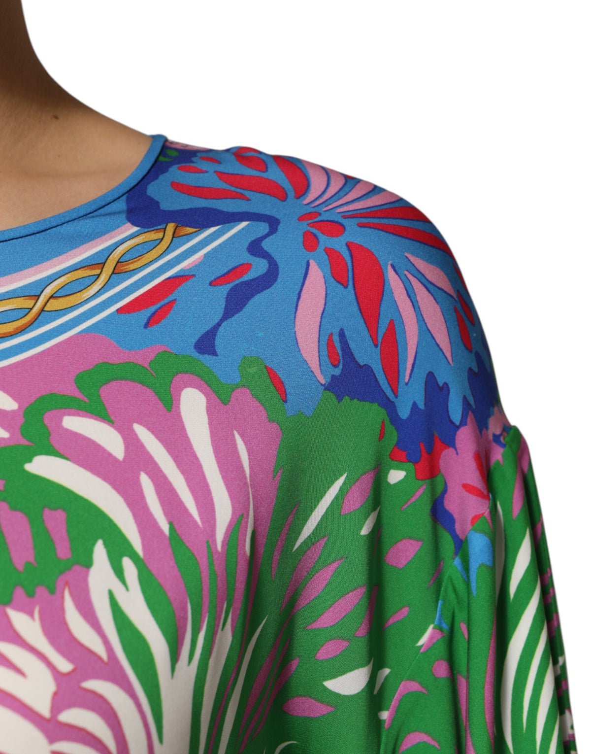 Elevate your wardrobe with the Dolce & Gabbana Multicolor Floral Print Silk Tunic Blouse, a luxurious blend of silk and elastane, embodying timeless Italian elegance and artistry.