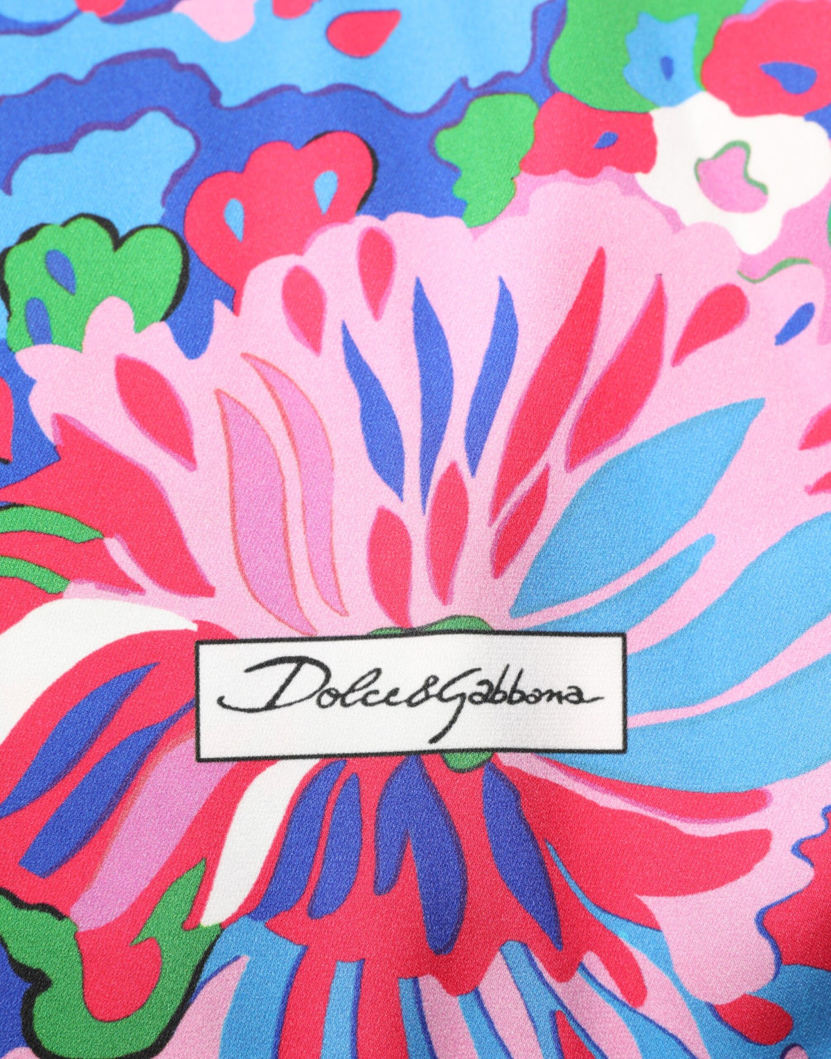 Indulge in the exquisite Dolce & Gabbana Multicolor Floral Print Silk Tunic Blouse, a timeless piece that embodies Italian craftsmanship and elevates your elegance.