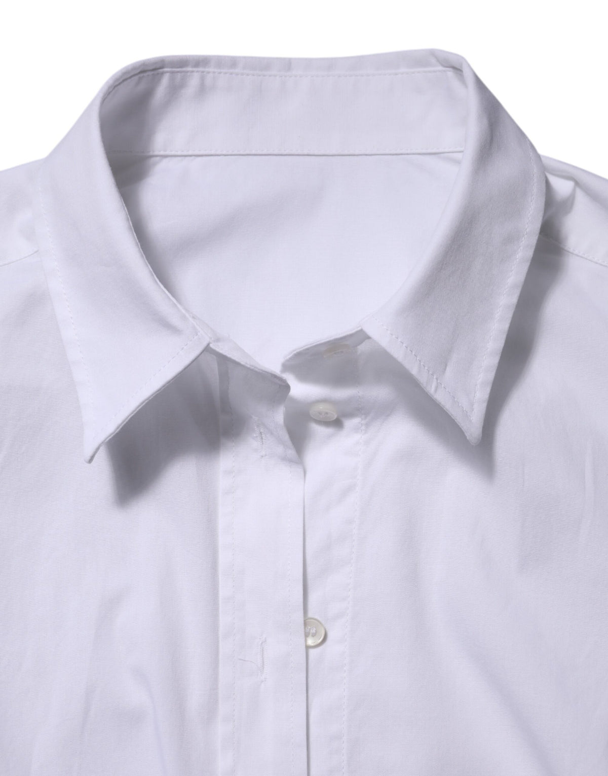 Experience the allure of Dolce & Gabbana's White Collared Long Sleeves Dress Shirt, a timeless blend of cotton and elastane, embodying Italian craftsmanship and elegance.