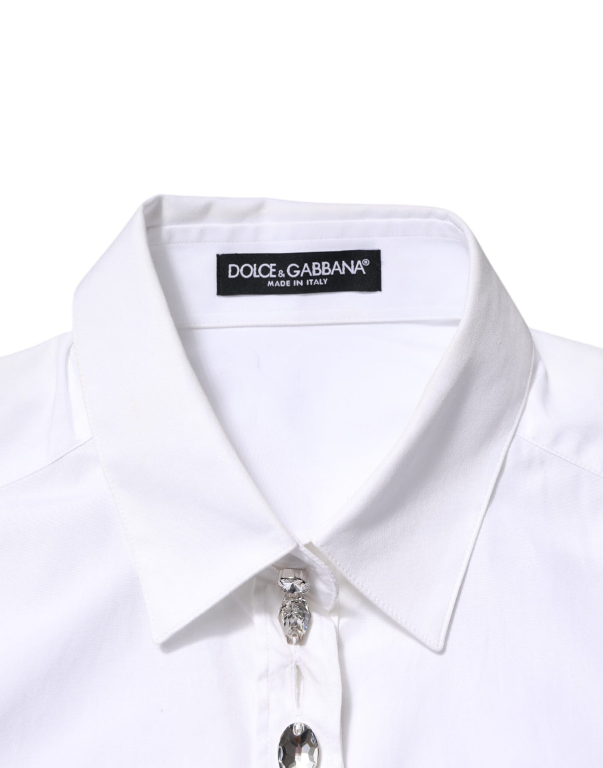 Elevate your wardrobe with the Dolce & Gabbana White Crystal Embellished Dress Shirt, a timeless blend of luxurious cotton and exquisite Italian craftsmanship, perfect for any occasion.