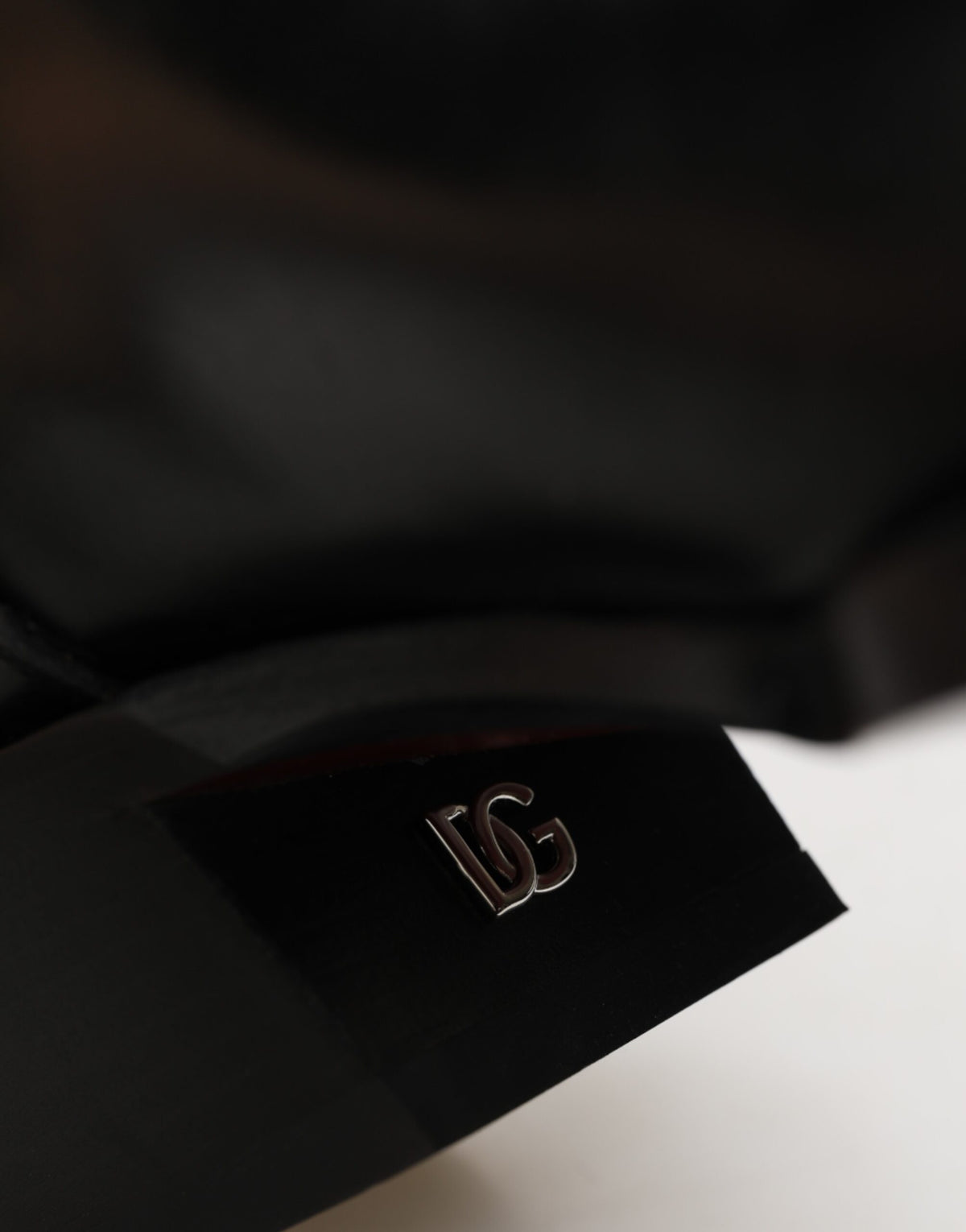 Elevate your style with Dolce & Gabbana's Black Logo Plaque Over The Calf Boots, crafted from premium leather for a luxurious statement in any setting.