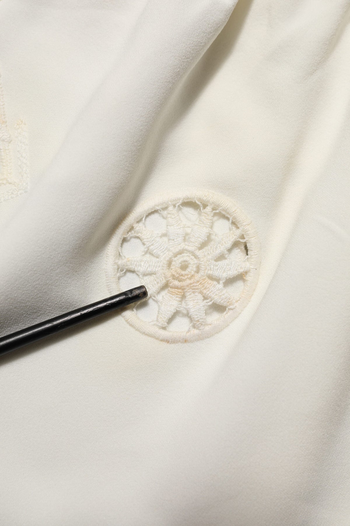 Indulge in the exquisite Dolce & Gabbana White Floral Lace Sleeveless Midi Dress, a timeless piece of haute couture that embodies luxury and elegance for the discerning individual.