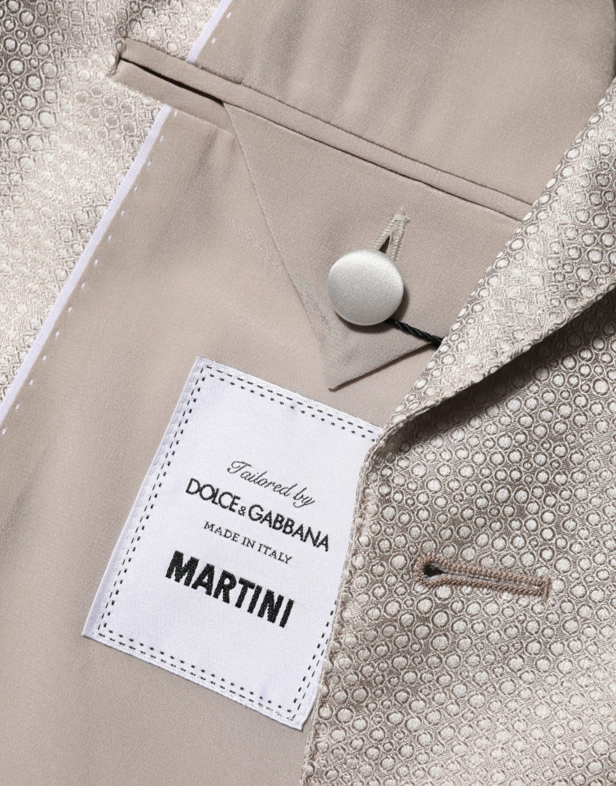 Elevate your elegance with the Dolce & Gabbana Beige MARTINI Double-Breasted Suit Blazer, a silk masterpiece that embodies timeless sophistication and Italian artistry.