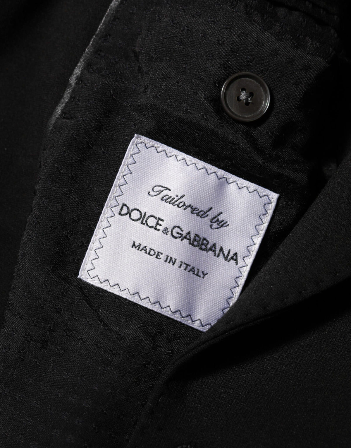 Elevate your wardrobe with the Dolce & Gabbana Black Viscose Suit Jacket Blazer, a timeless blend of luxurious craftsmanship and effortless elegance, perfect for any occasion.