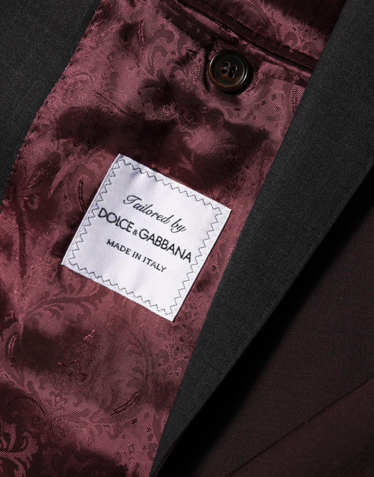 Indulge in the exquisite Dolce & Gabbana Maroon Wool Blazer, a masterpiece of Italian craftsmanship that elevates your elegance and sophistication for any occasion.