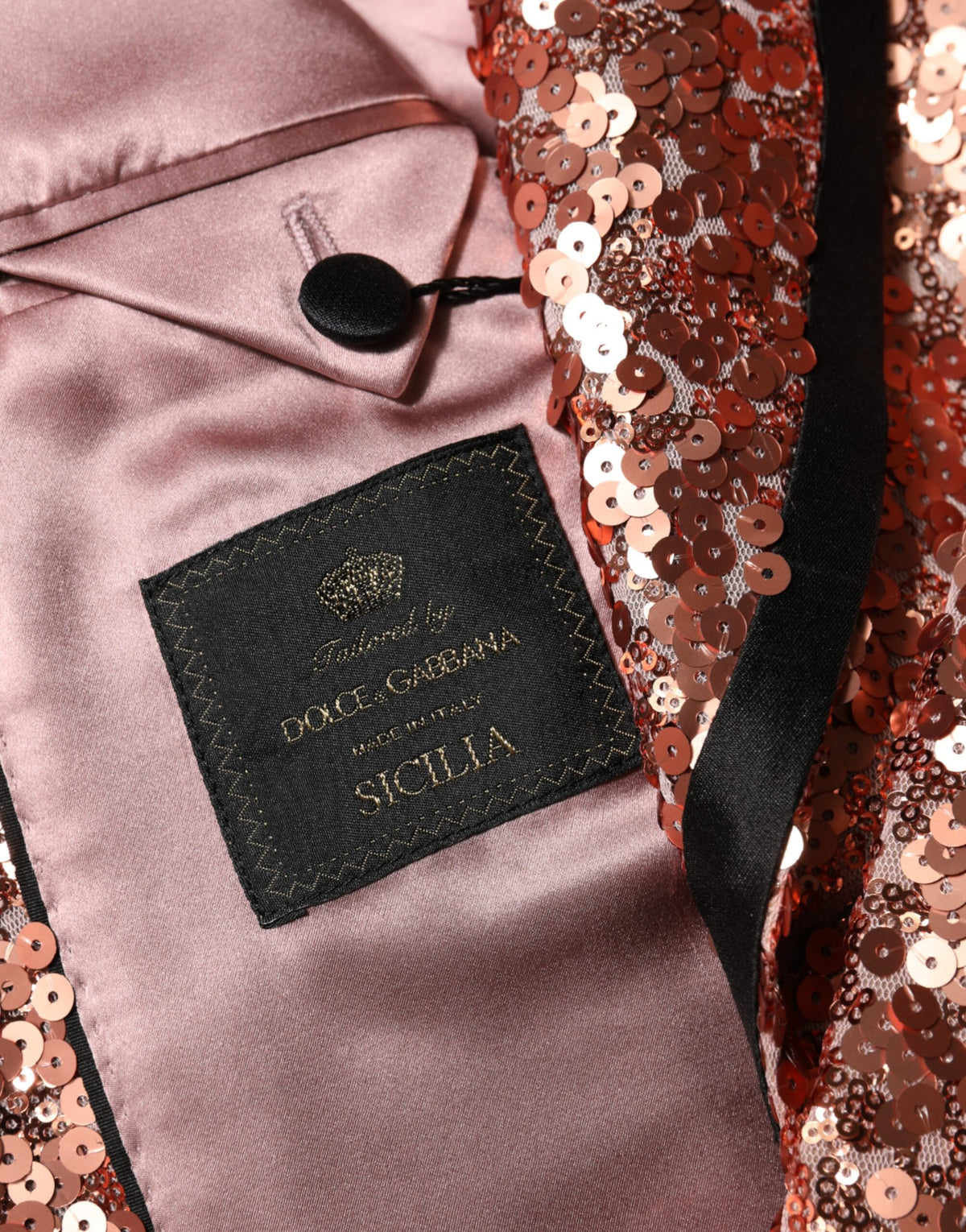 Indulge in the exquisite allure of the Dolce & Gabbana Pink Sequin SICILIA Blazer, a masterpiece of Italian craftsmanship that elevates your evening attire with unparalleled elegance.