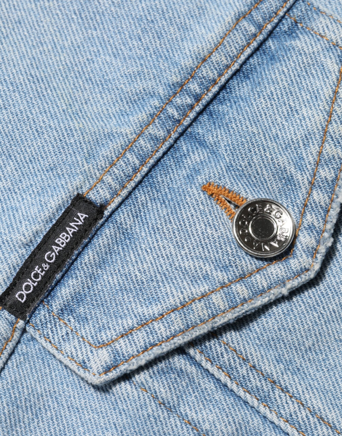 Indulge in the exquisite Dolce & Gabbana Blue Nylon Patchwork Denim Sheath Mini Dress, a masterpiece of Italian craftsmanship that embodies timeless elegance and modern allure.