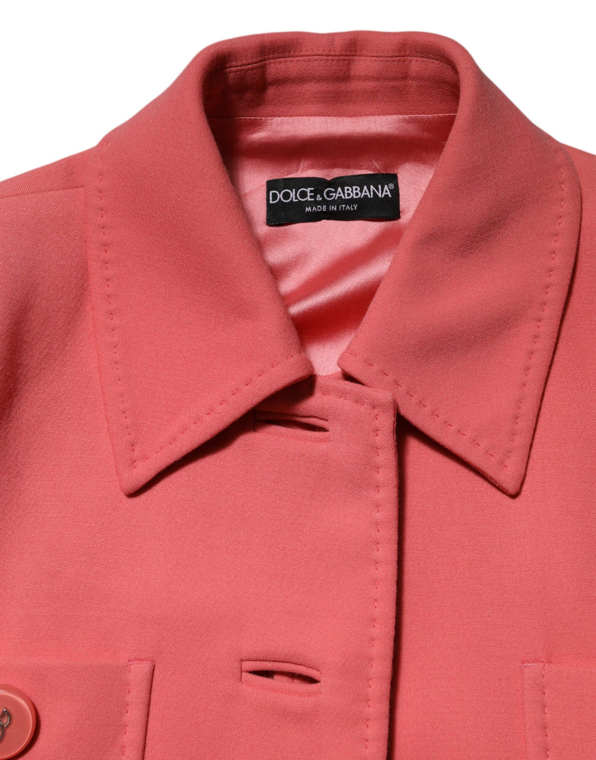 Indulge in the exquisite Dolce & Gabbana Pink Buttoned Down Trench Coat, a luxurious blend of wool, silk, and elastane, embodying timeless elegance and Italian craftsmanship.