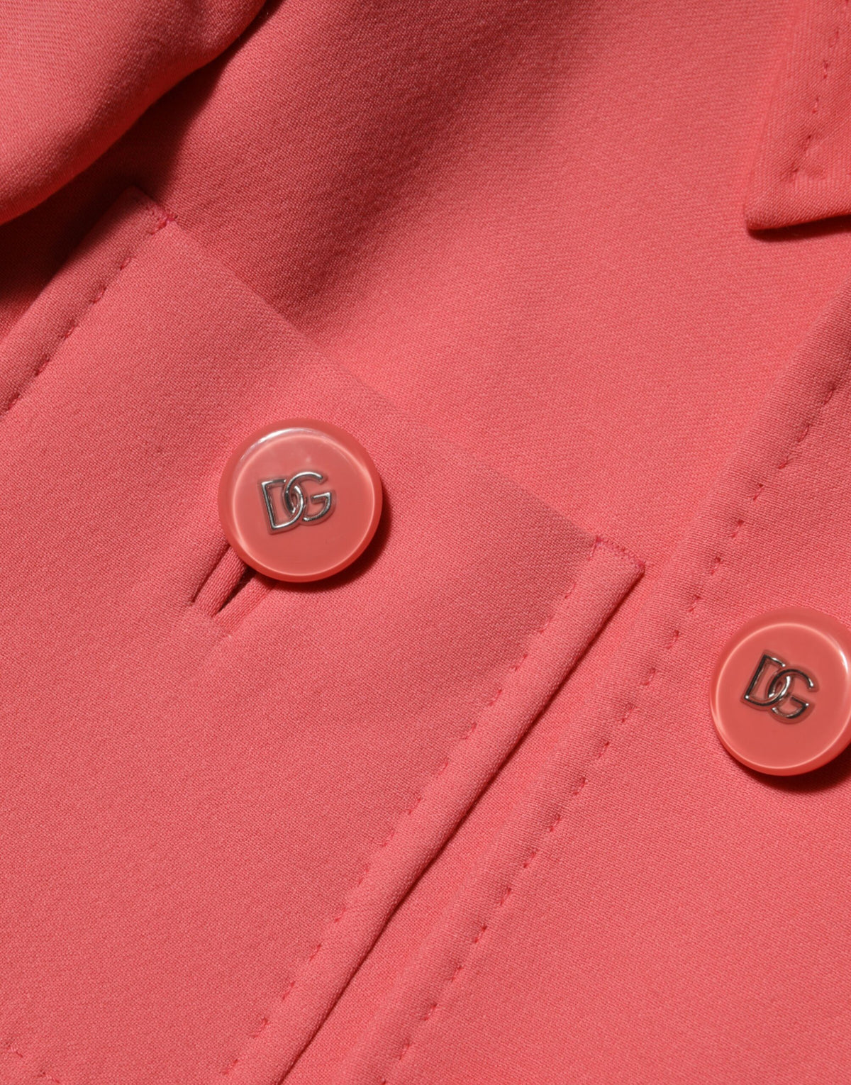 Indulge in the exquisite Dolce & Gabbana Pink Buttoned Down Trench Coat, a masterpiece of Italian craftsmanship, blending luxurious wool and silk for timeless elegance.
