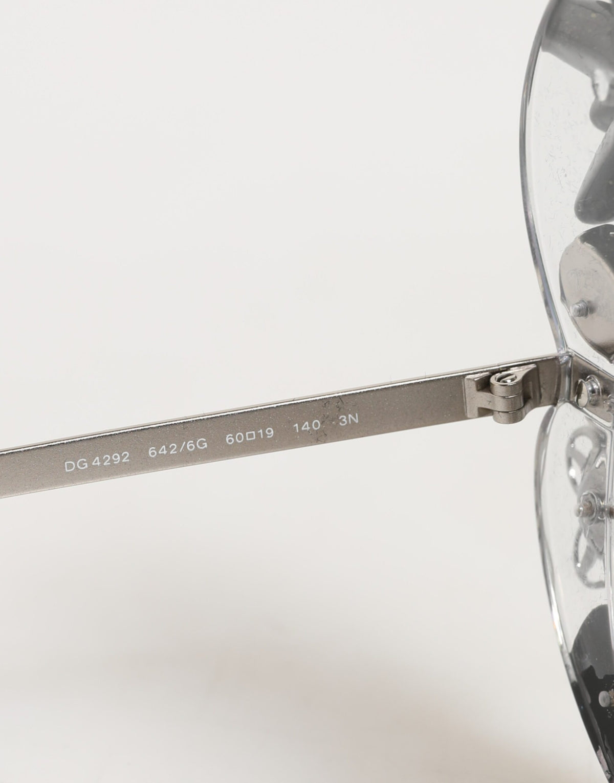 Indulge in the exquisite elegance of Dolce & Gabbana's DG4292 sunglasses, where handcrafted artistry meets luxurious sophistication for the discerning individual.