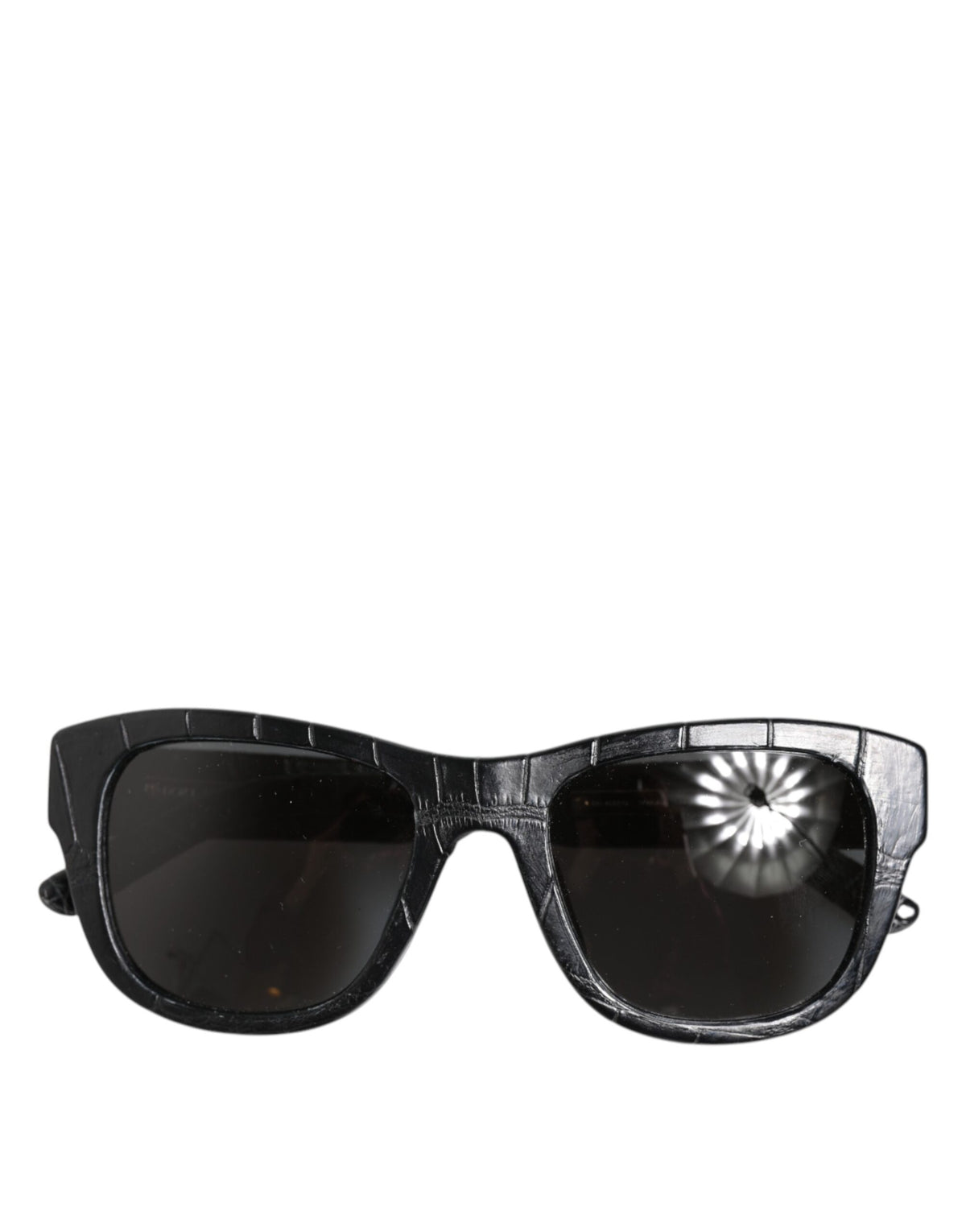 Indulge in the exquisite allure of Dolce & Gabbana DG4177 sunglasses, crafted from luxurious alligator leather, embodying timeless elegance and sophisticated style.