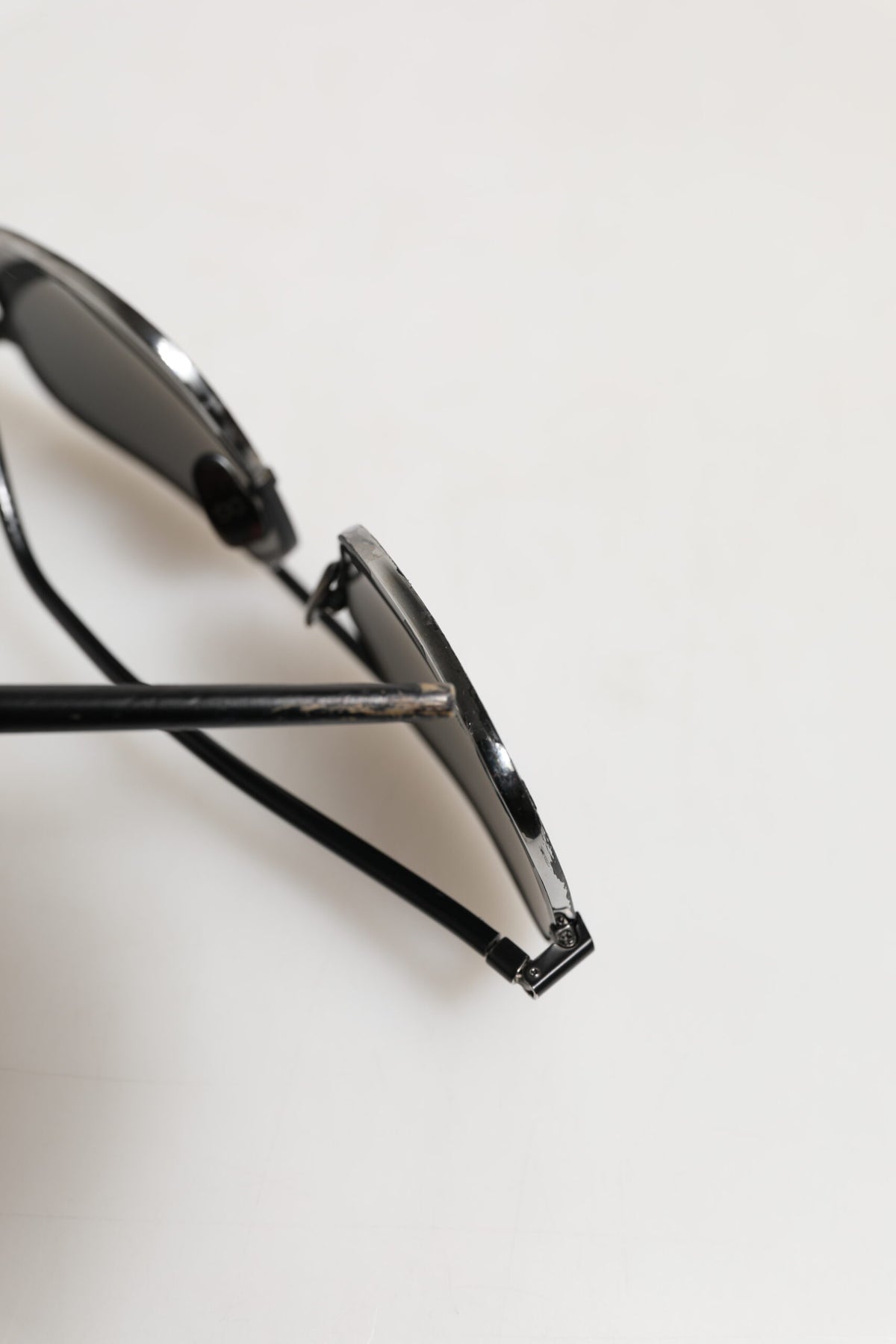 Discover the allure of Dolce & Gabbana's Black Metal Frame Square Lenses Sunglasses, where exquisite craftsmanship meets timeless luxury, perfect for the discerning individual.
