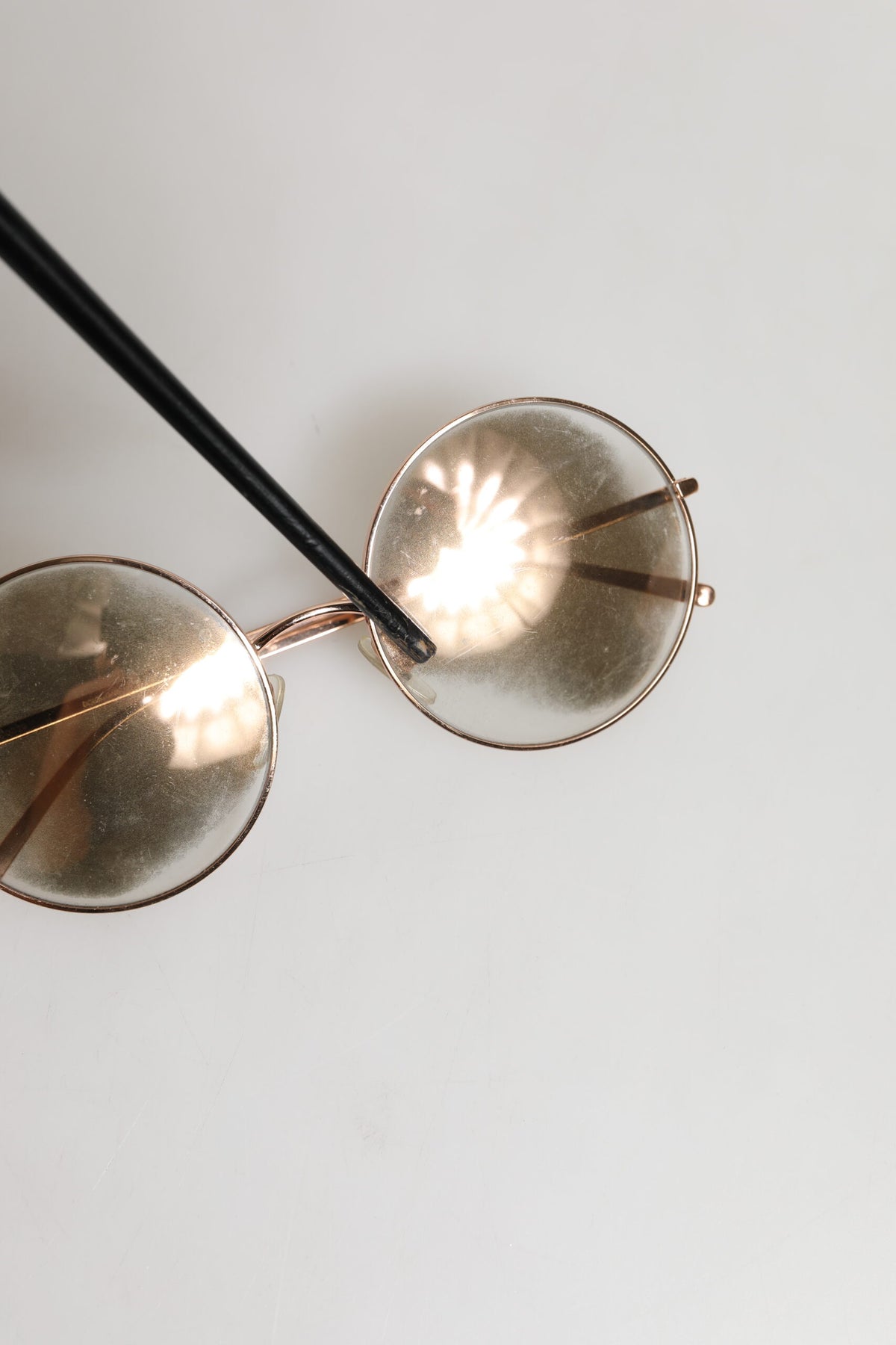 Experience the allure of Dolce & Gabbana's Rose Gold Plated Round Lenses Sunglasses, a symbol of luxury and sophistication crafted in Italy, perfect for the discerning individual.