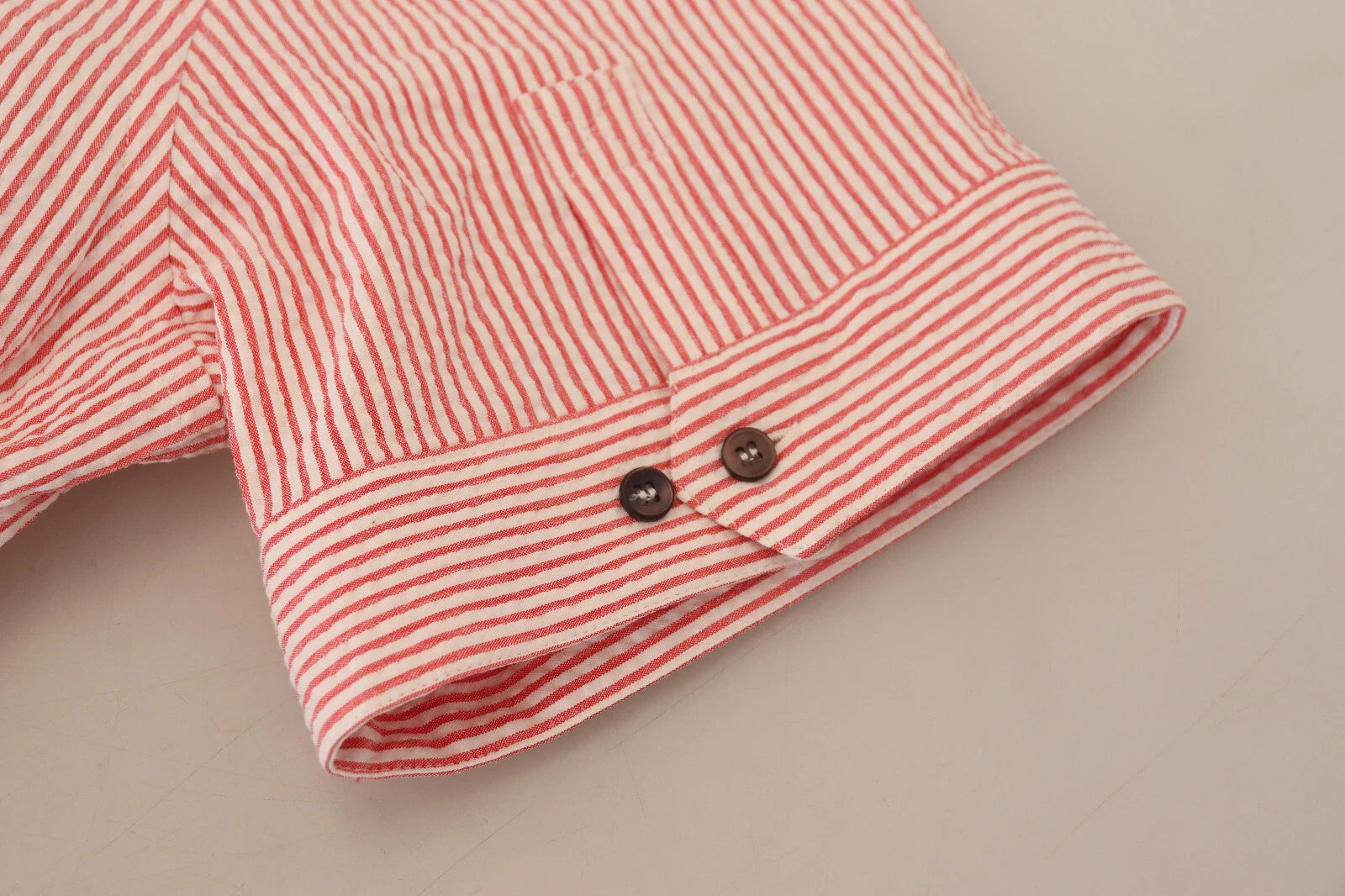 Elevate your wardrobe with the Dolce & Gabbana Red White Striped Cotton Short Sleeve Shirt, a masterpiece of Italian craftsmanship that embodies timeless elegance and versatility.