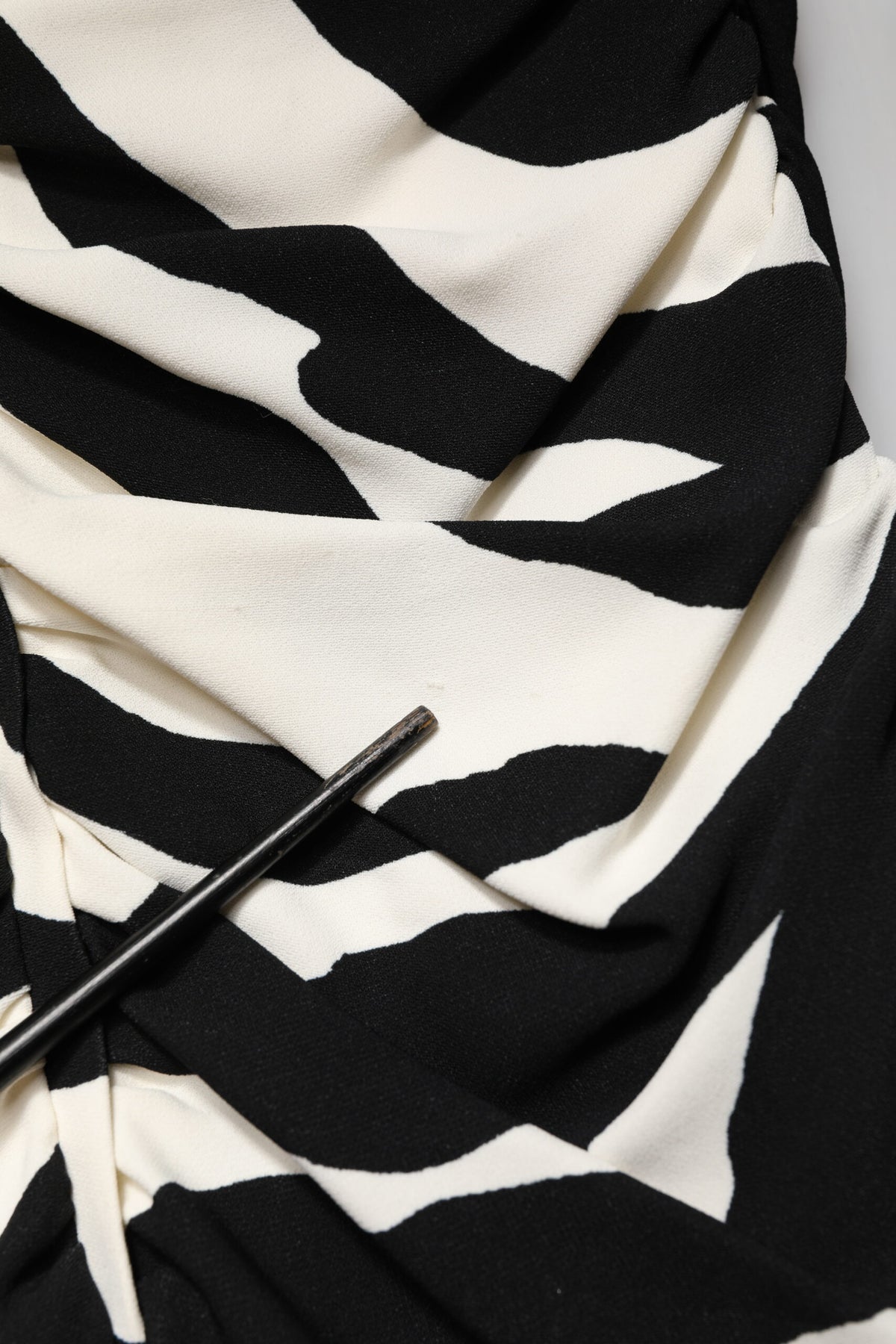 Experience the allure of the Dolce & Gabbana Black White Zebra Viscose Sheath Midi Dress, a masterpiece of haute couture that embodies luxury and sophistication.