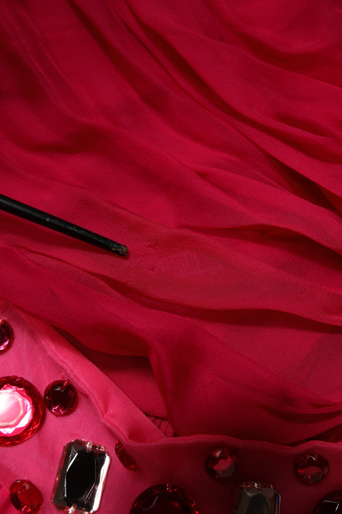Indulge in the exquisite allure of the Dolce & Gabbana Pink Silk Embellished A-line Midi Dress, a masterpiece of Italian craftsmanship that redefines elegance for any occasion.