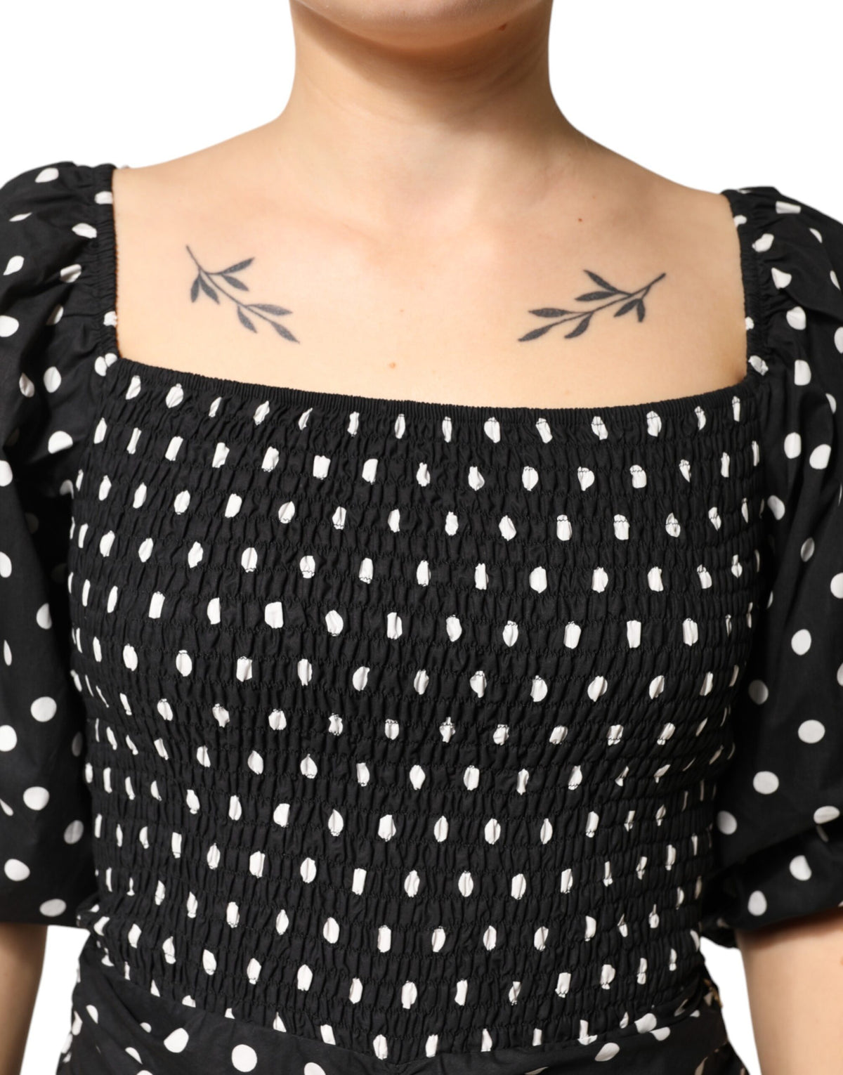 Indulge in the elegance of Patrizia Pepe's black and white polka dot mini dress, a timeless piece crafted from 100% cotton, perfect for sophisticated occasions.